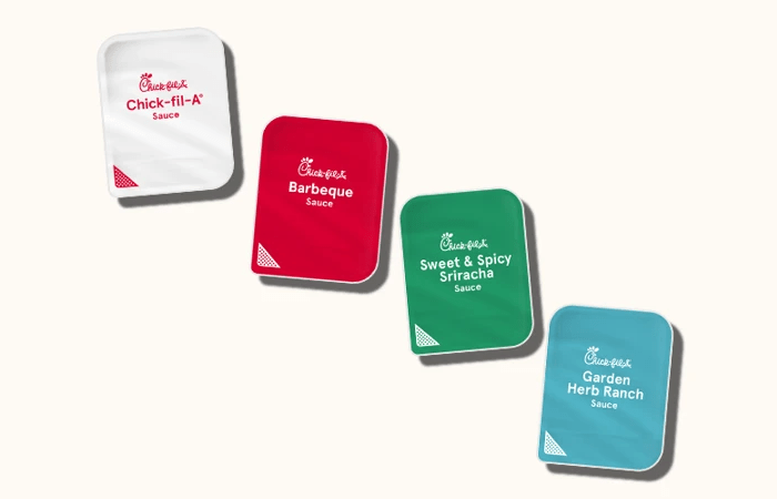 Four dipping sauce pots including Chick-fil-A® Sauce, Barbeque Sauce, Sweet & Spicy Sriracha Sauce, and Garden Herb Ranch Sauce